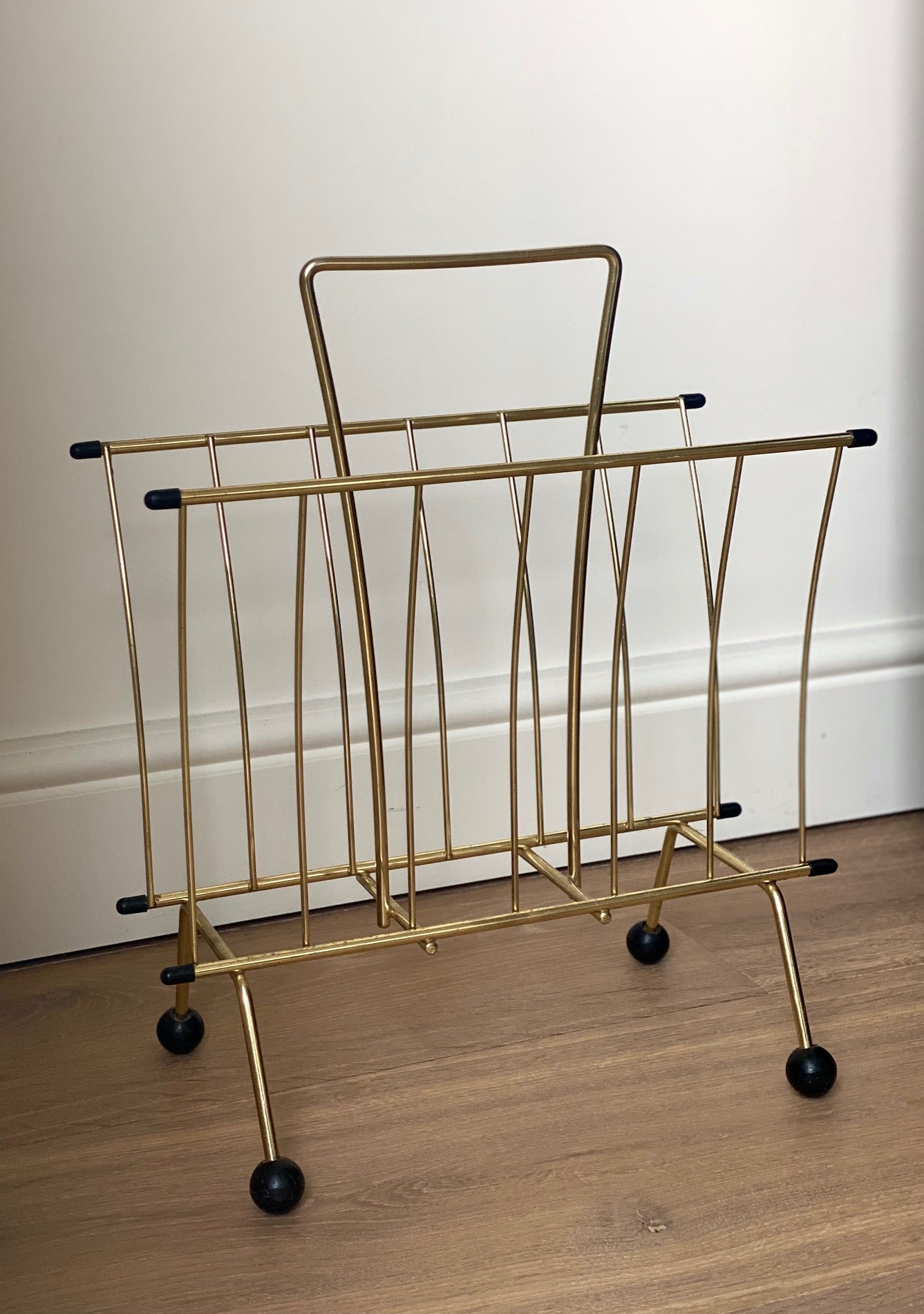 Brass magazine rack with ball feet