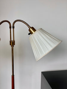KEPT London Stock A brass and teak floor lamp, mid 20th century