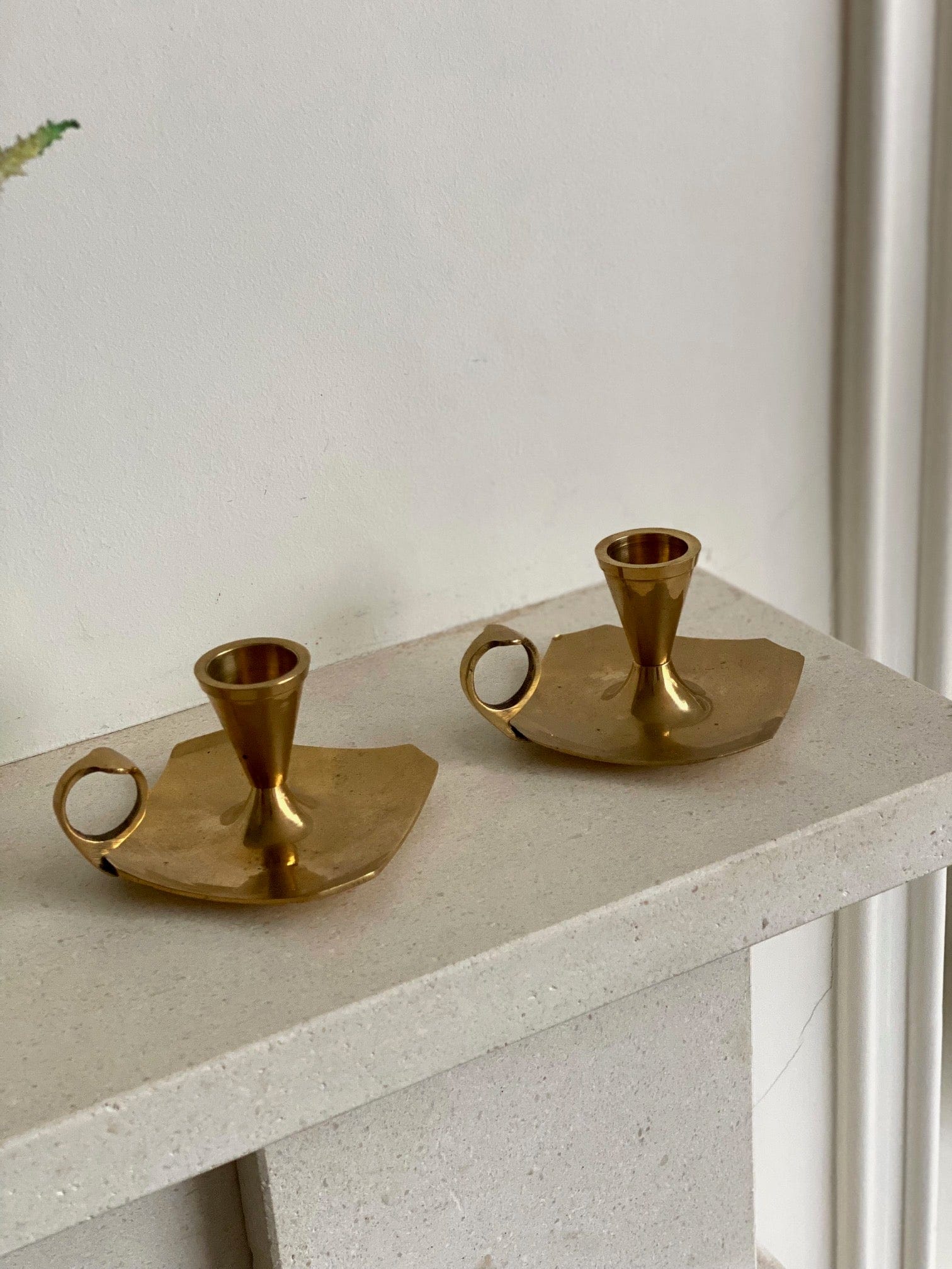 KEPT London A pair of brass chamberstick candle holders