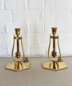 KEPT London A pair of brass ship candlesticks