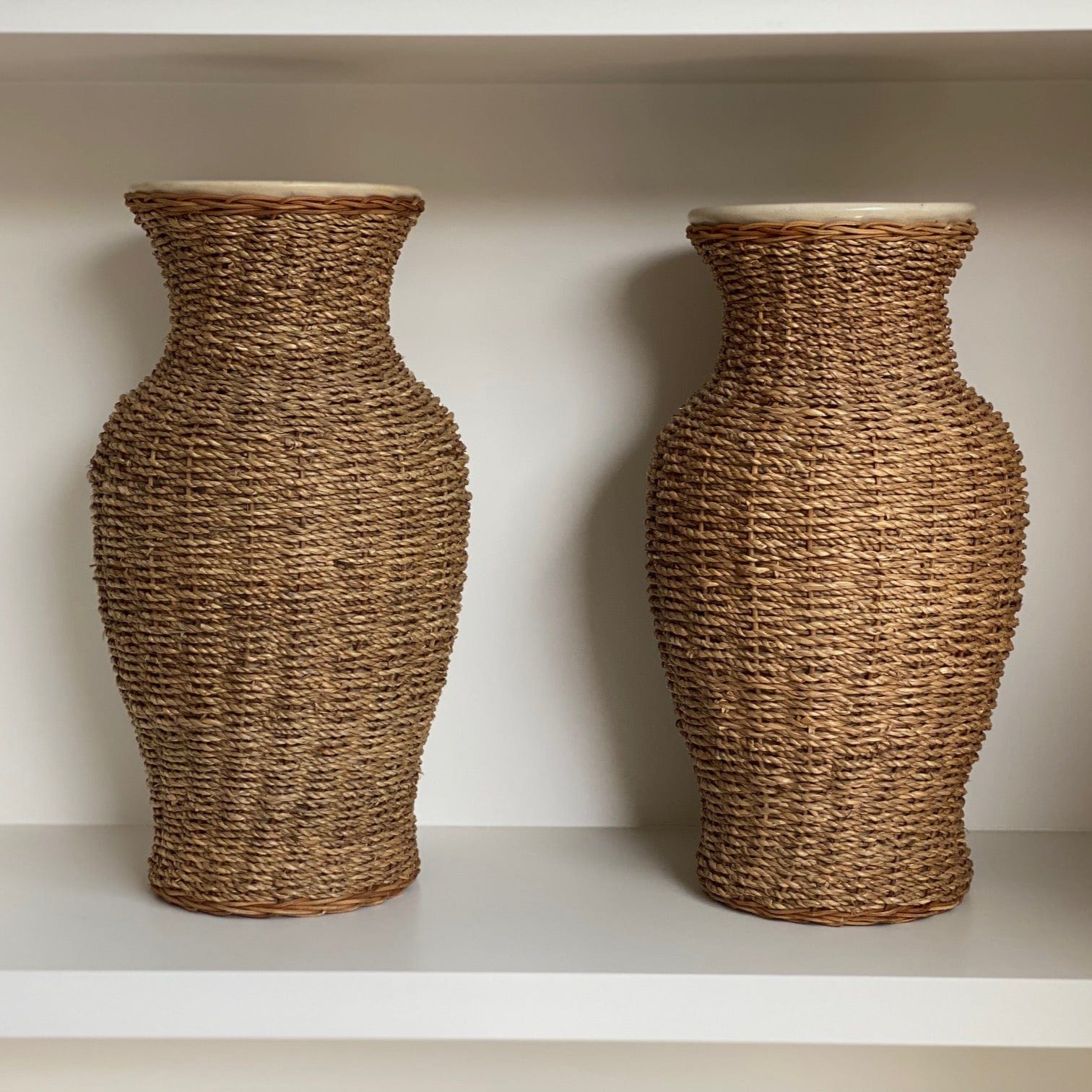 KEPT London Stock A pair of large rattan wrapped ceramic vases