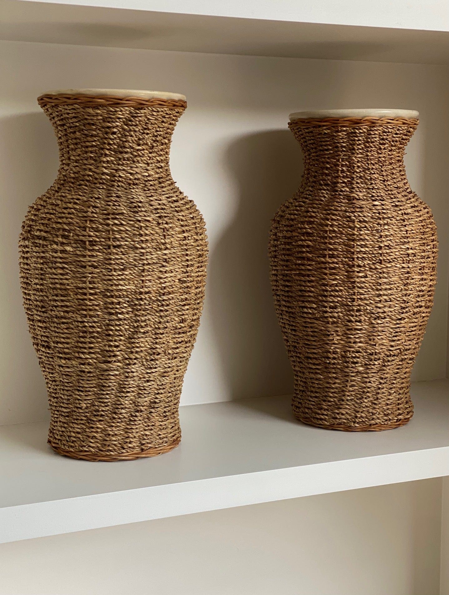KEPT London Stock A pair of large rattan wrapped ceramic vases