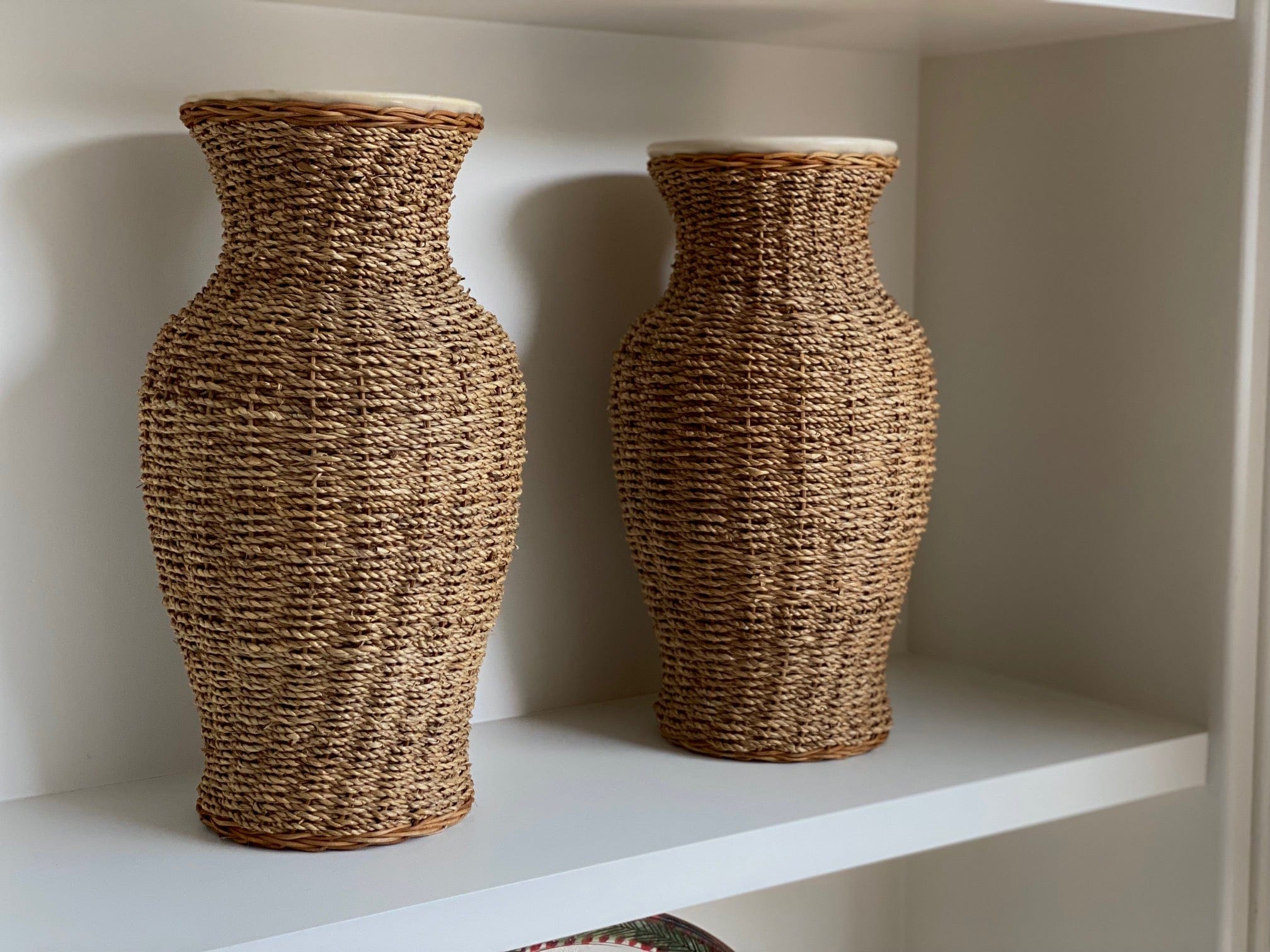KEPT London Stock A pair of large rattan wrapped ceramic vases