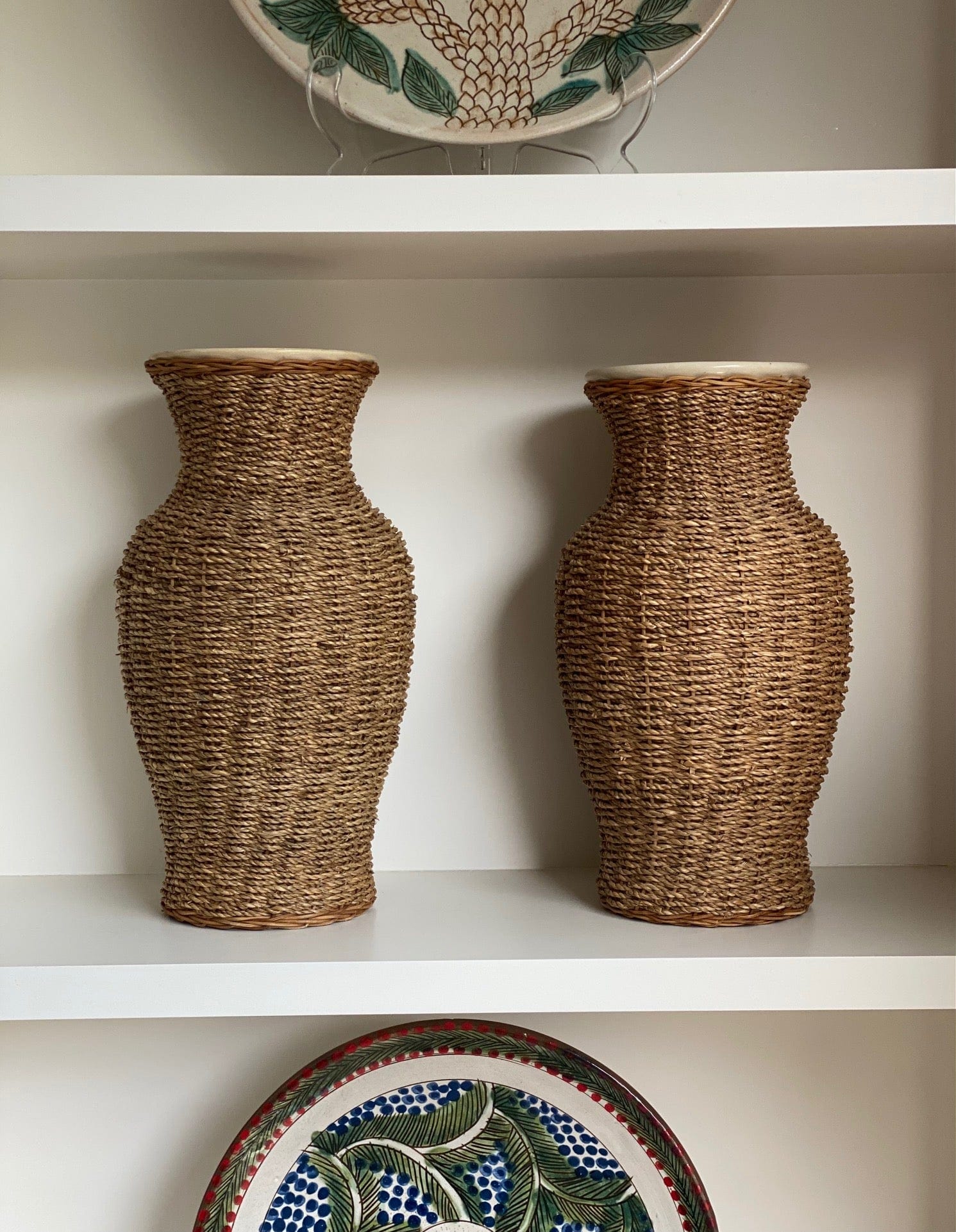 KEPT London Stock A pair of large rattan wrapped ceramic vases