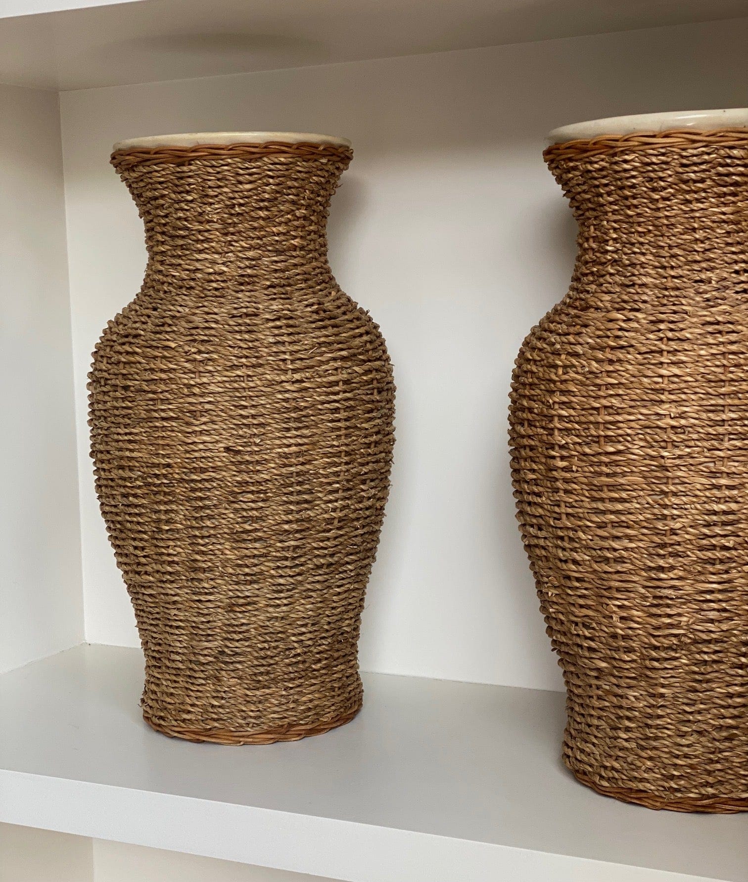 KEPT London Stock A pair of large rattan wrapped ceramic vases
