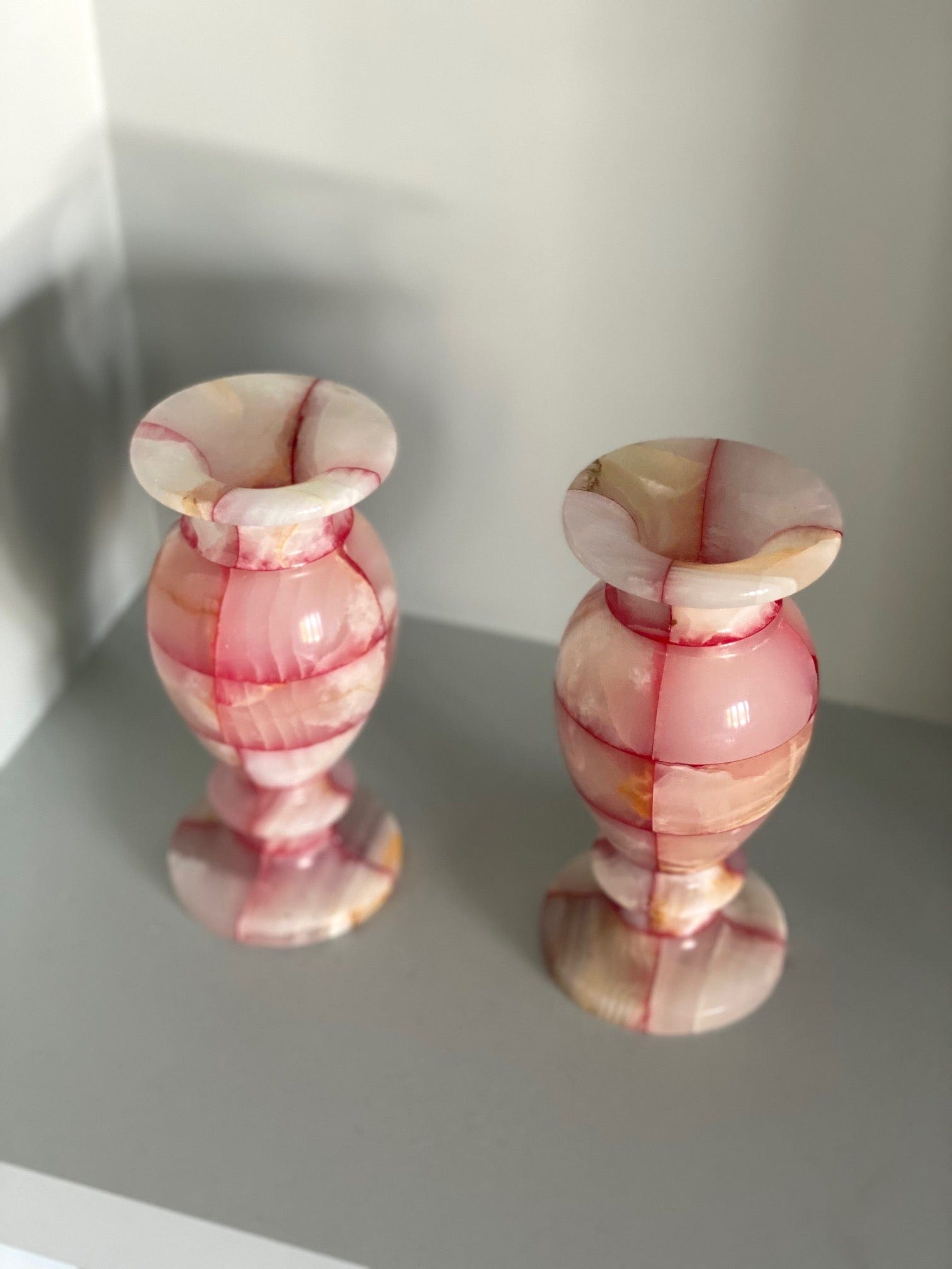 KEPT London A pair of pink and white onyx vases