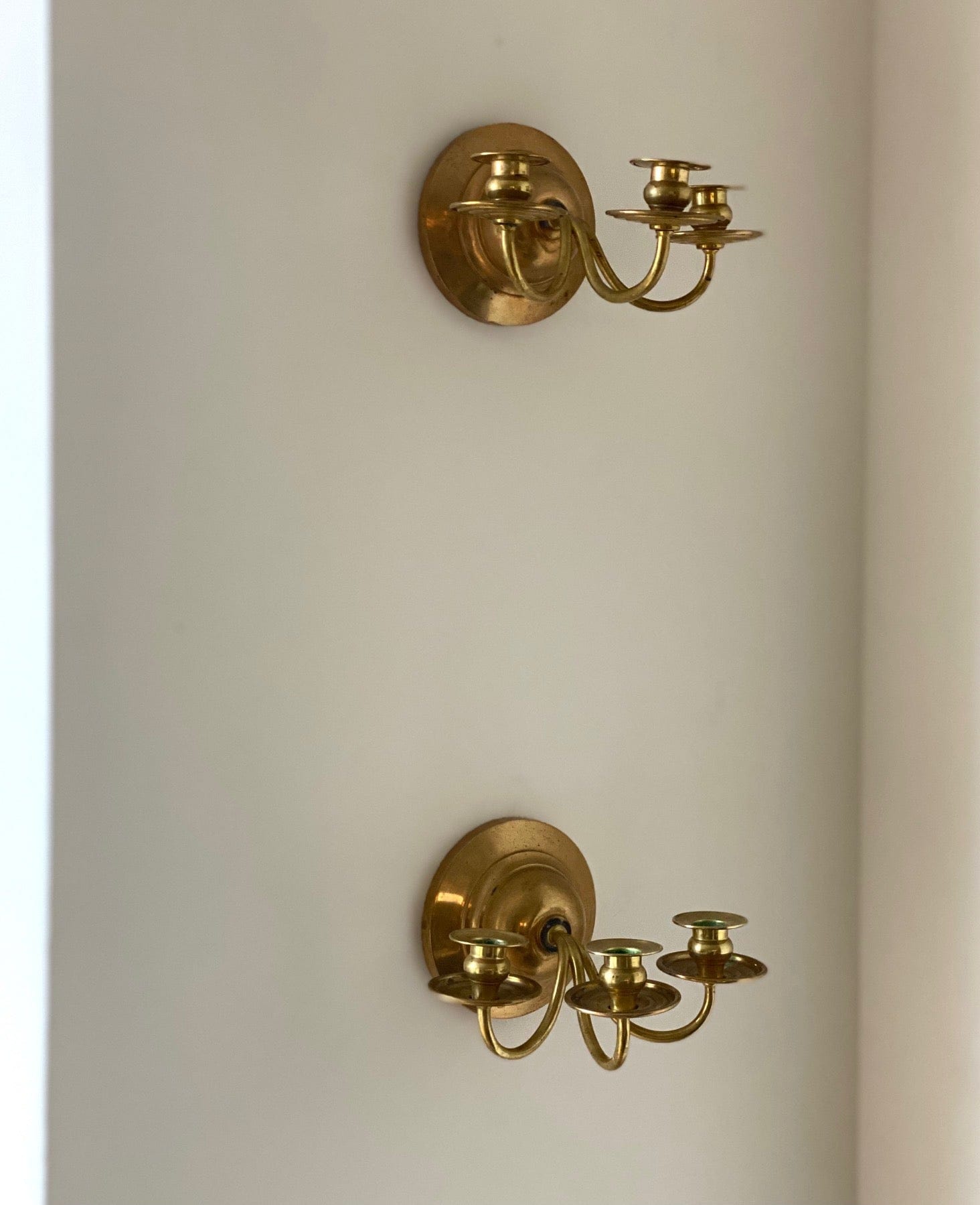 KEPT London A pair of three armed wall sconces