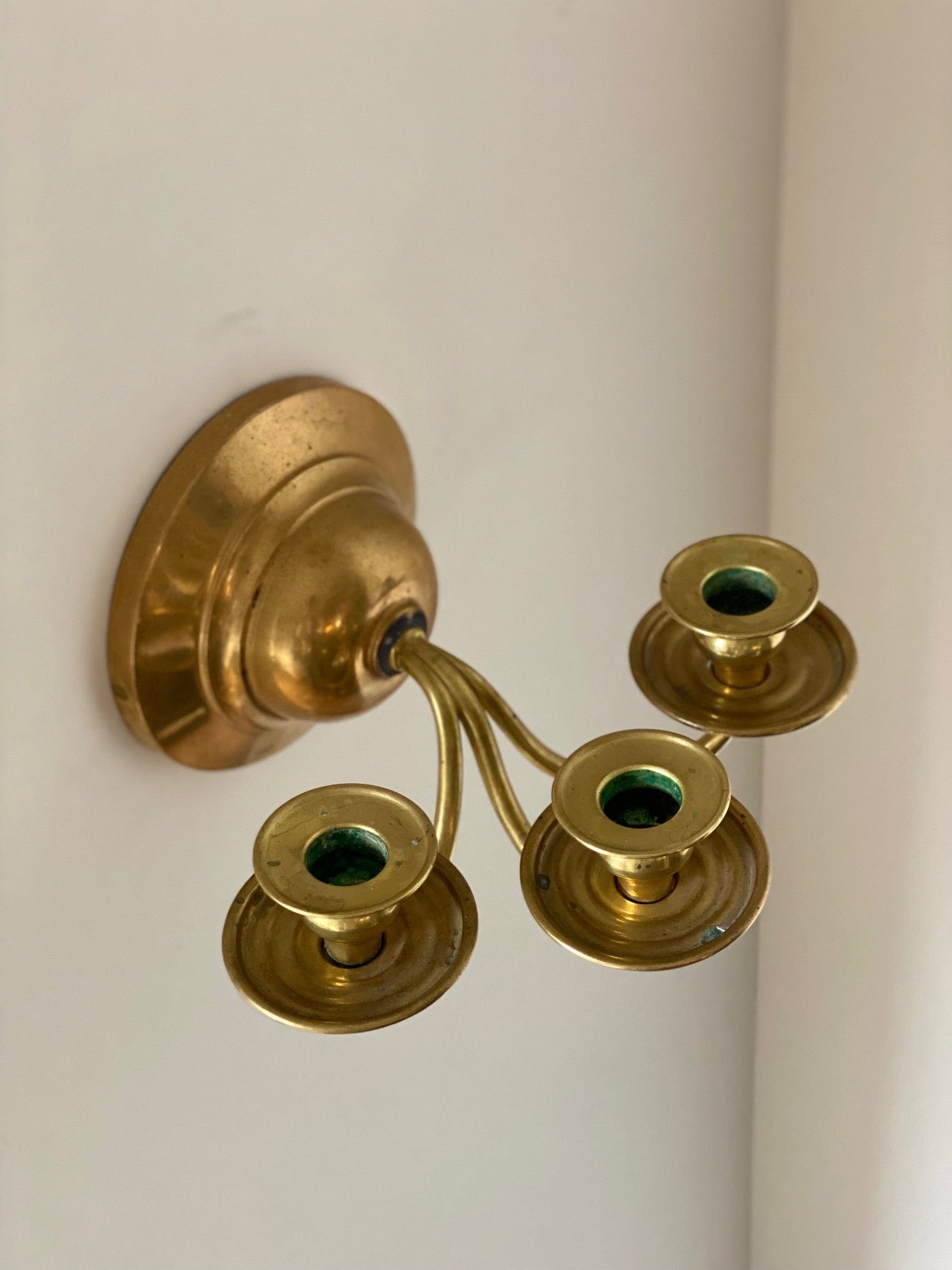 KEPT London A pair of three armed wall sconces