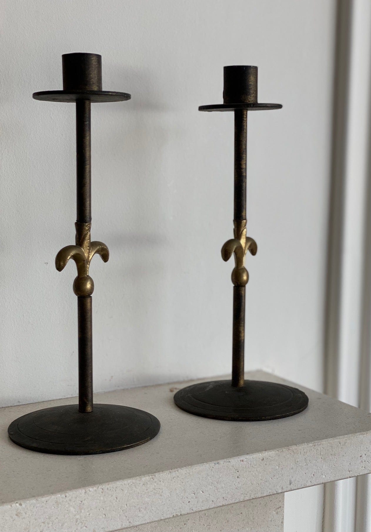 KEPT London Iron and brass candlesticks