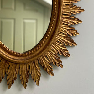 Oval sunburst giltwood mirror