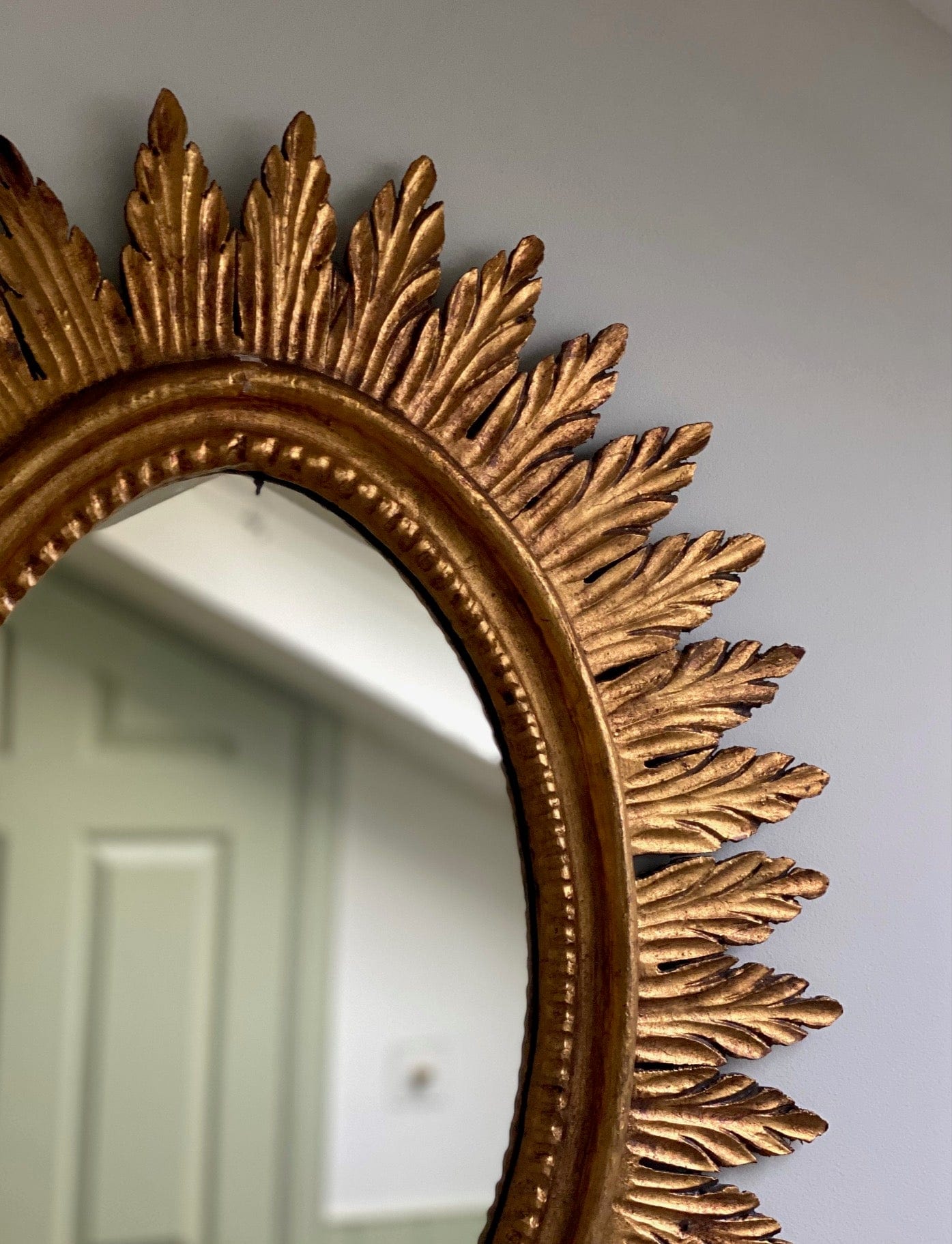 KEPT London Oval sunburst giltwood mirror