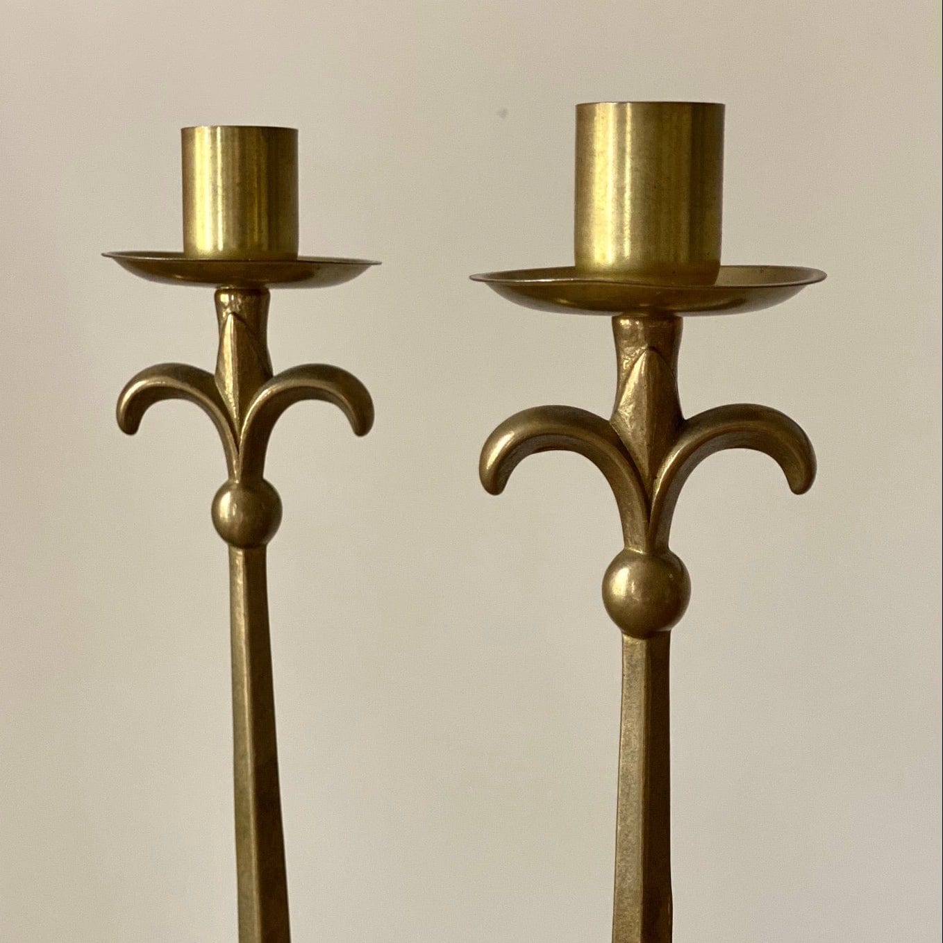 KEPT London Stock Pair of brass stalk candlesticks
