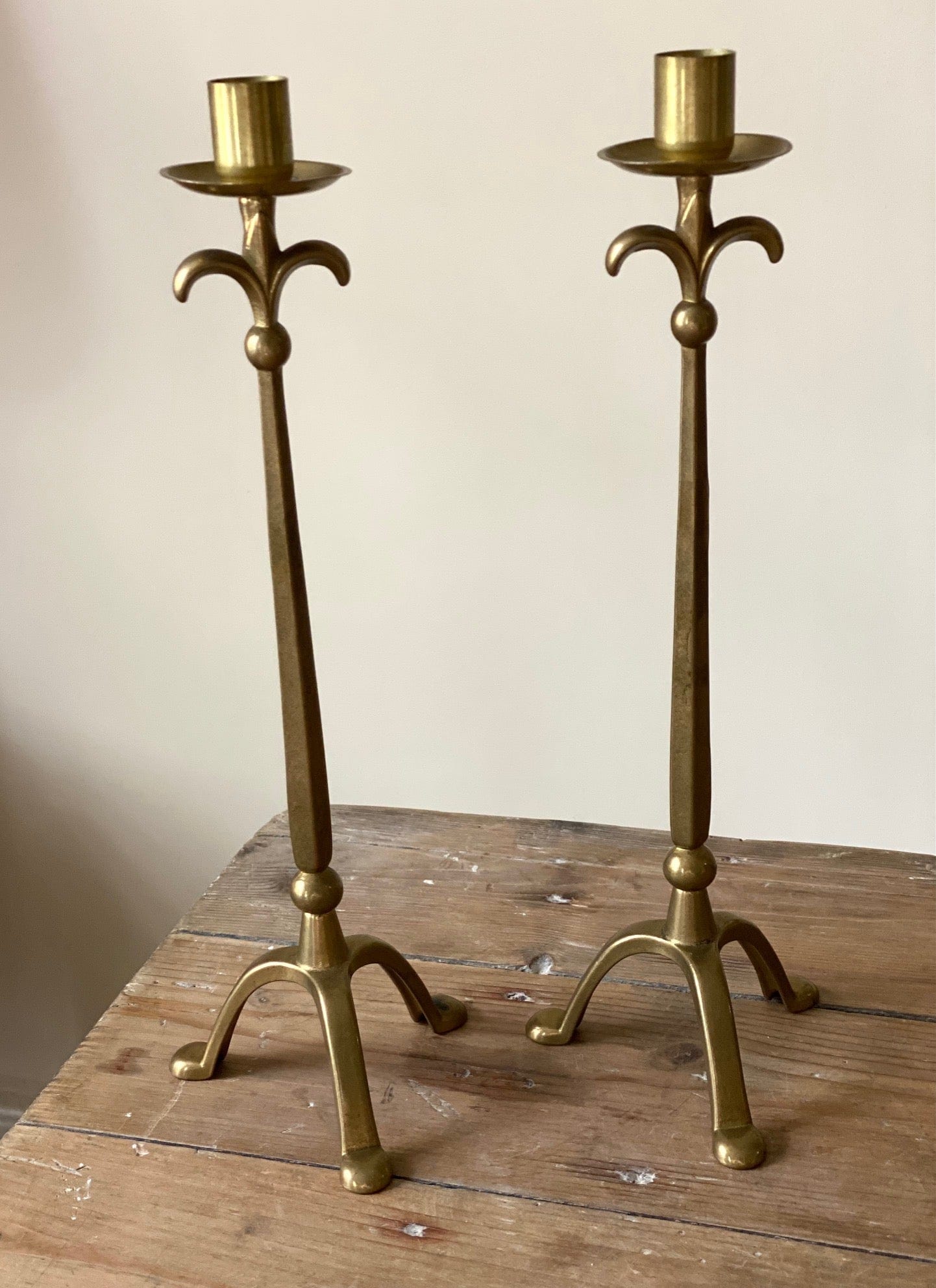 KEPT London Stock Pair of brass stalk candlesticks