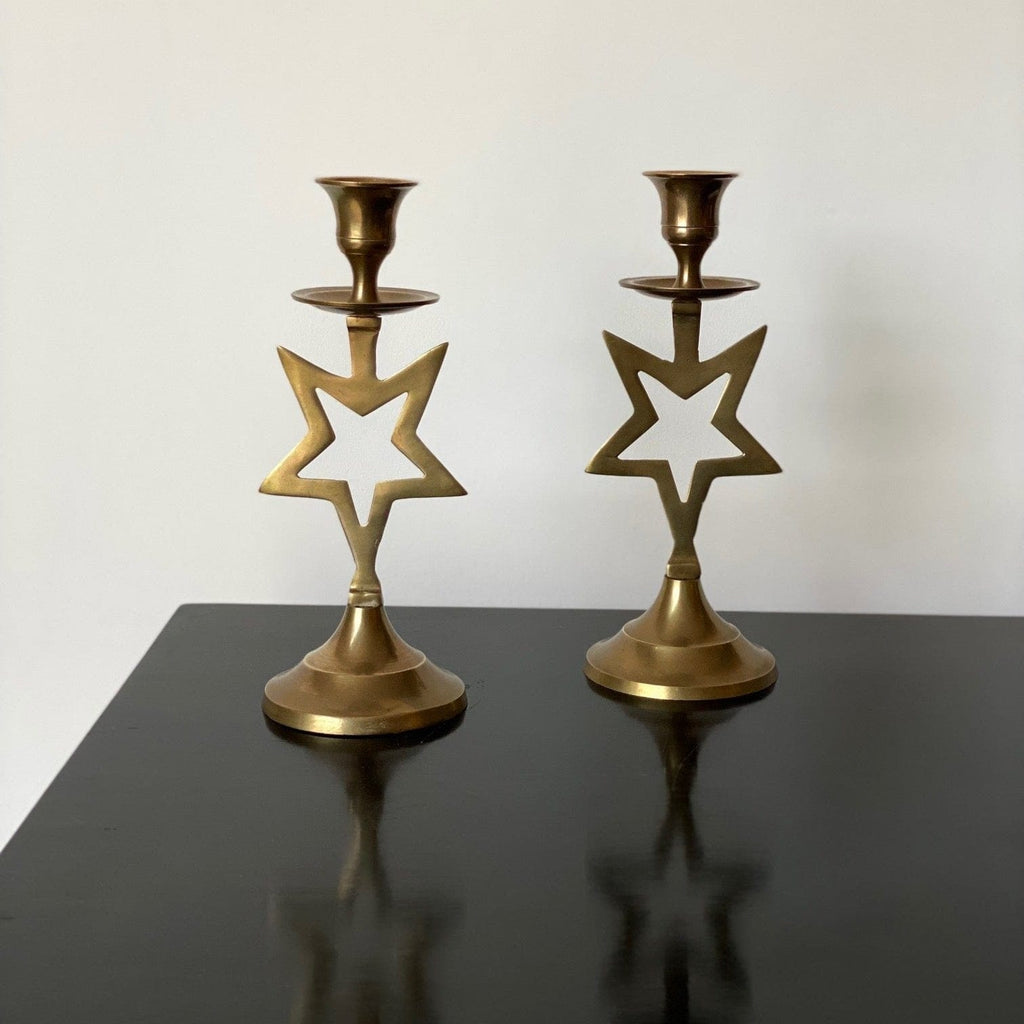 KEPT London Stock Pair of brass star candlesticks