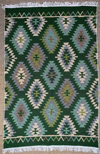 KEPT London Stock Pair of green and peach kilim style rugs