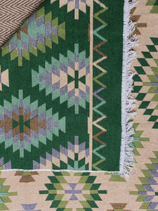 KEPT London Stock Pair of green and peach kilim style rugs