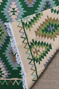 KEPT London Stock Pair of green and peach kilim style rugs