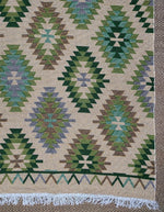Load image into Gallery viewer, KEPT London Stock Pair of green and peach kilim style rugs
