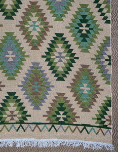 KEPT London Stock Pair of green and peach kilim style rugs