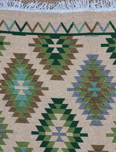 KEPT London Stock Pair of green and peach kilim style rugs
