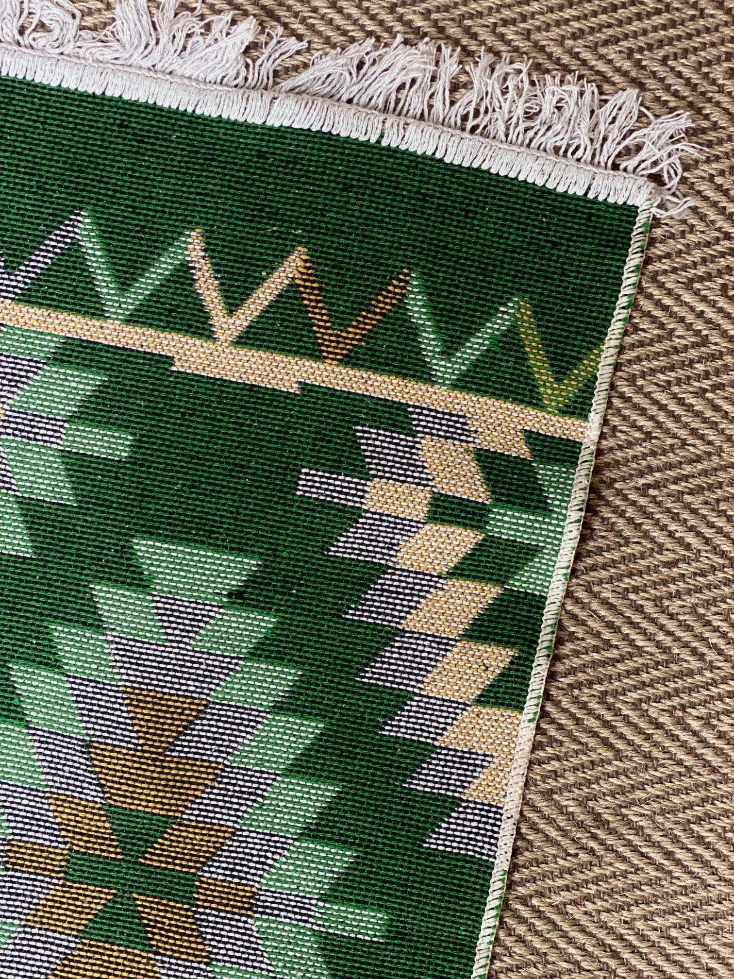 KEPT London Stock Pair of green and peach kilim style rugs