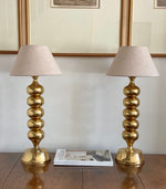 Load image into Gallery viewer, KEPT London Stock Pair of large brass bobbin table lamps
