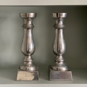 KEPT London Pair of silver metal candlesticks
