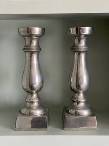 KEPT London Pair of silver metal candlesticks