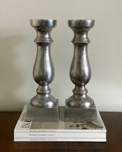 KEPT London Pair of silver metal candlesticks