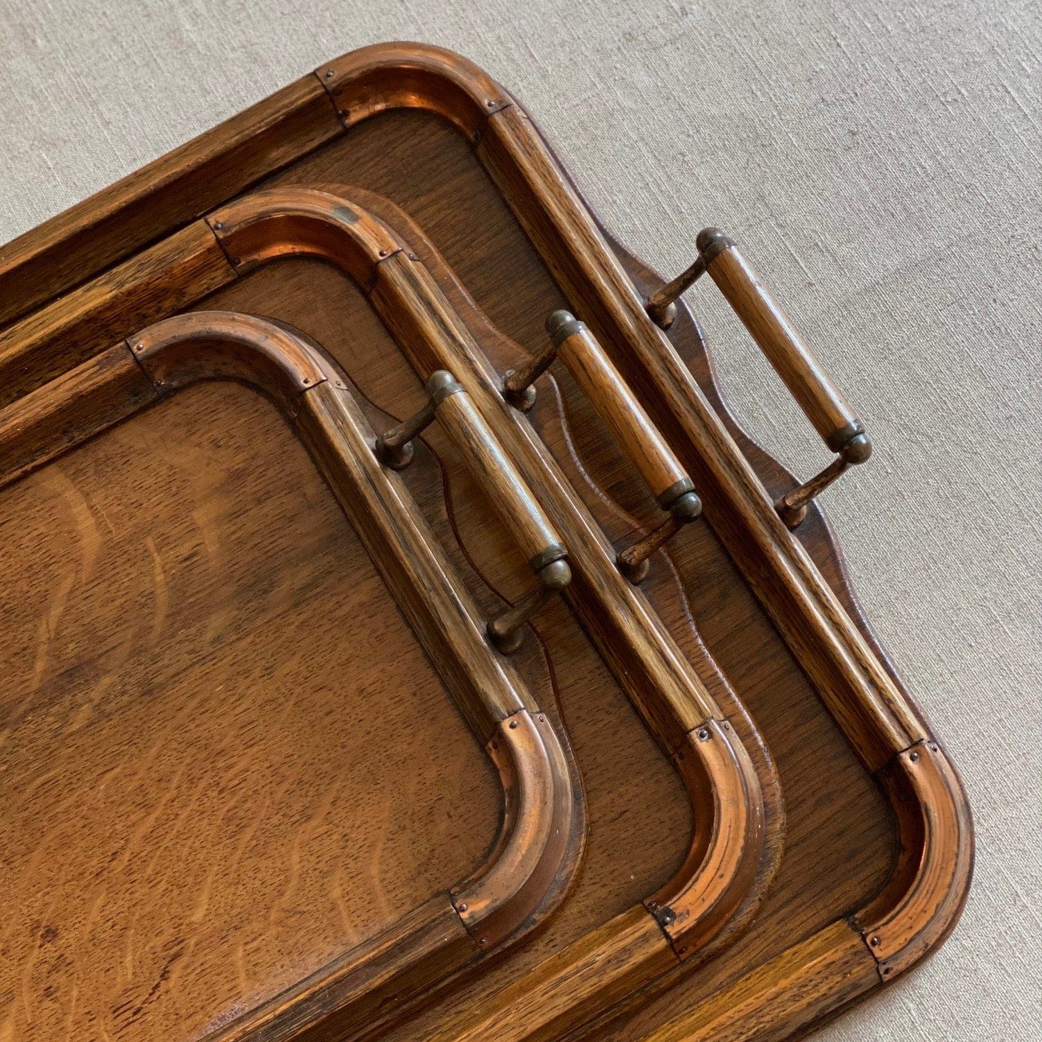 KEPT London Stock Set of three oak trays with copper detail