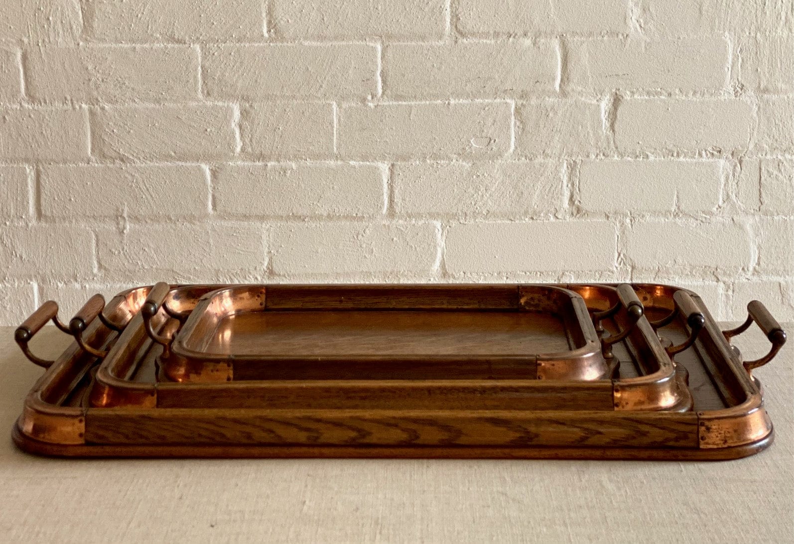 KEPT London Stock Set of three oak trays with copper detail