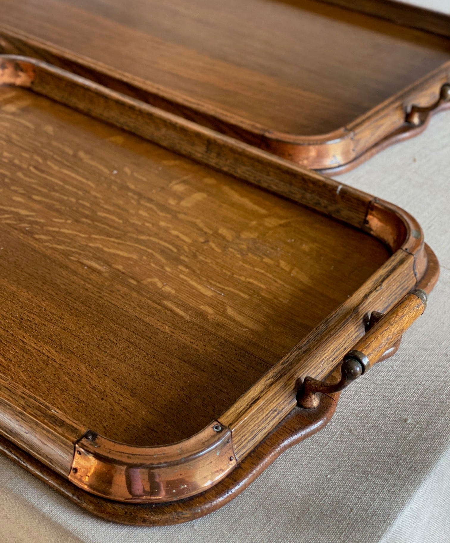 KEPT London Stock Set of three oak trays with copper detail