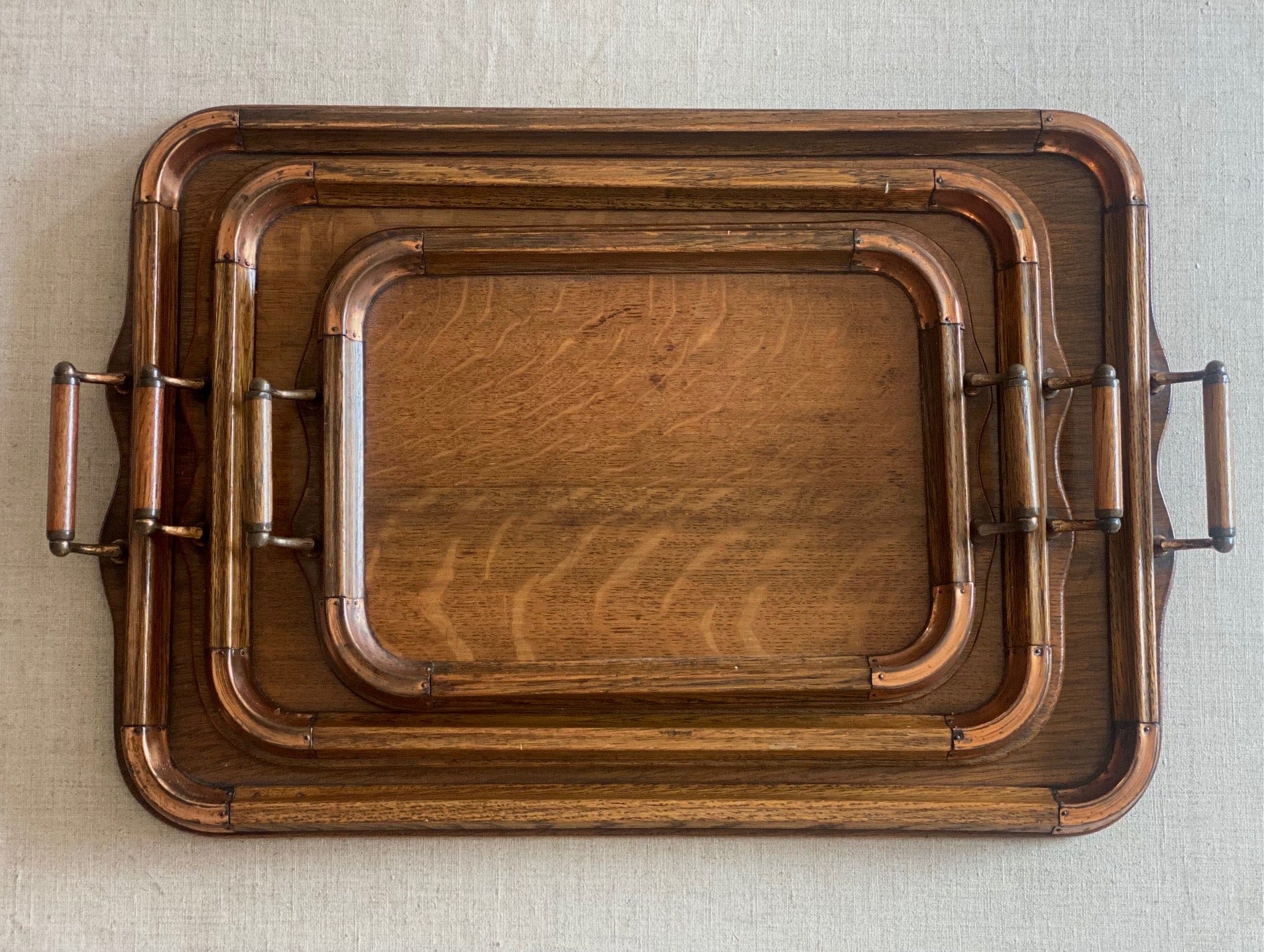 KEPT London Stock Set of three oak trays with copper detail