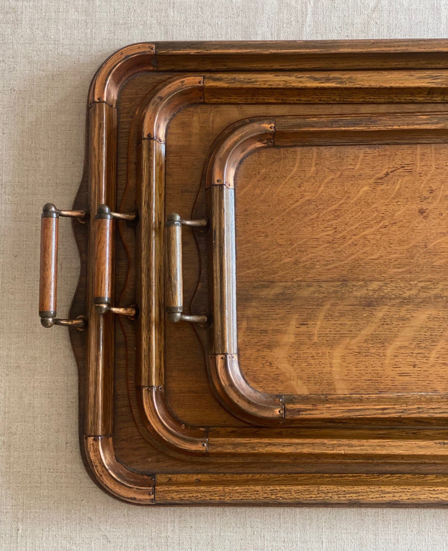 KEPT London Stock Set of three oak trays with copper detail