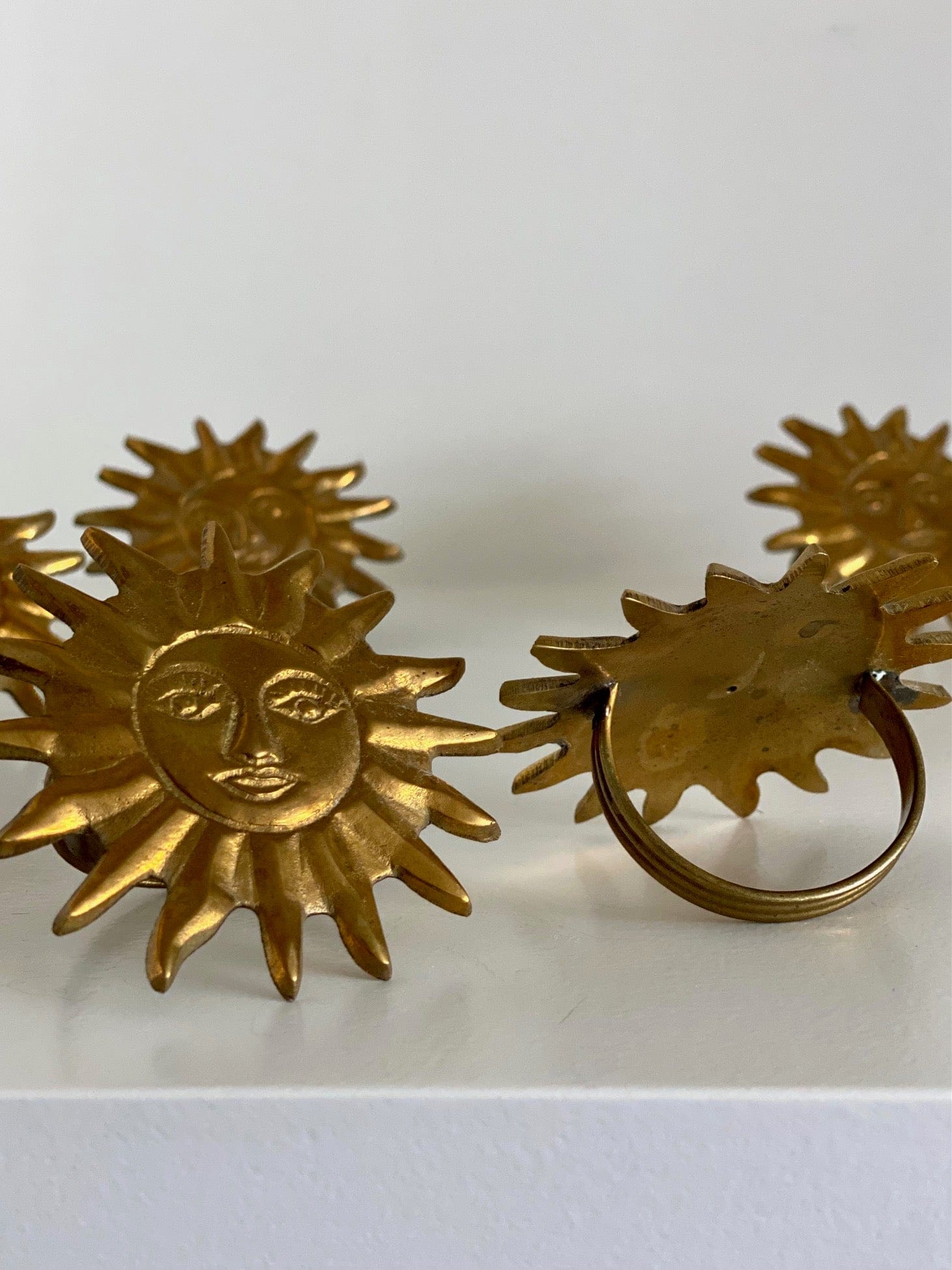 KEPT London Six sunburst brass napkin rings