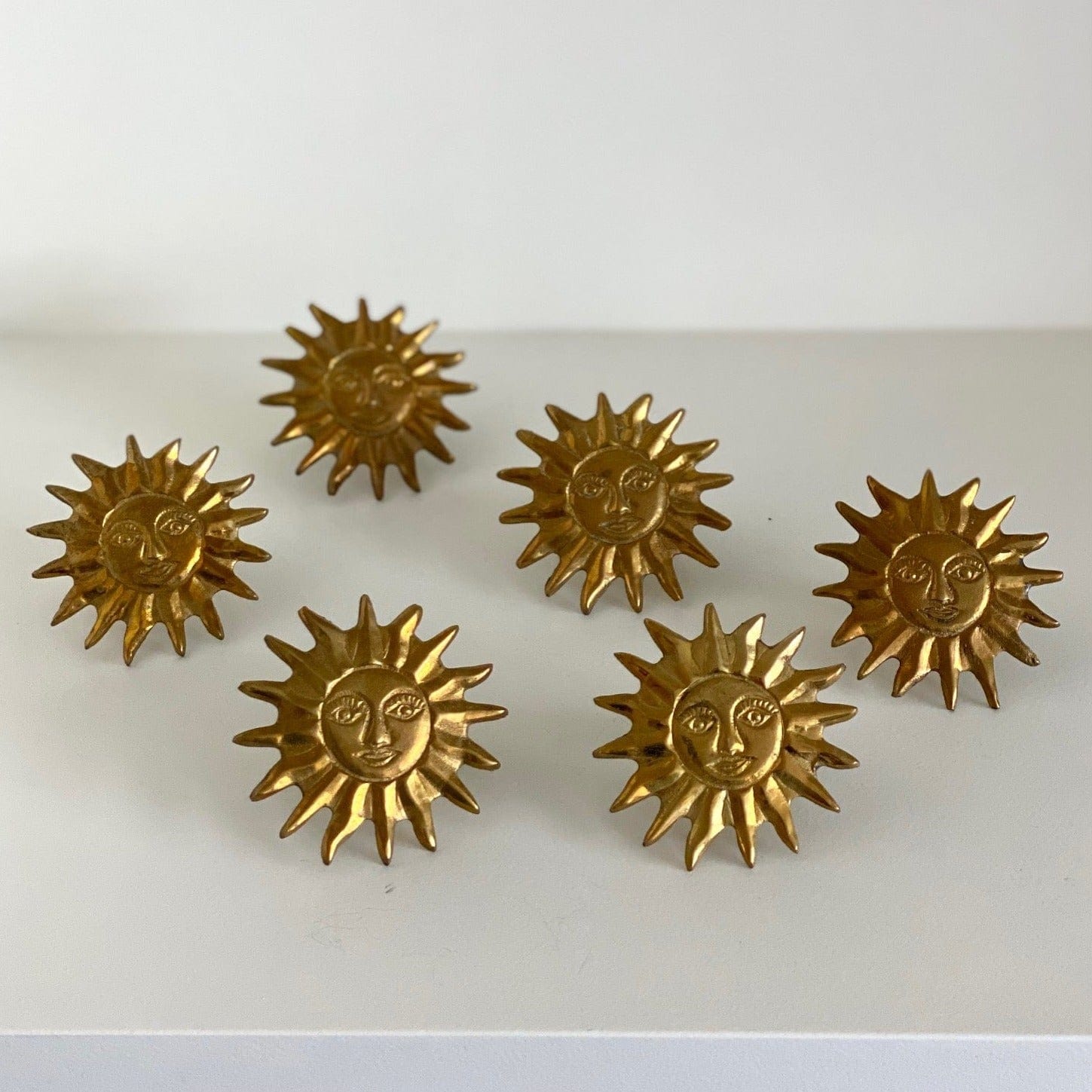 KEPT London Six sunburst brass napkin rings